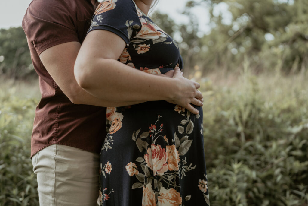 photo of hands on a belly