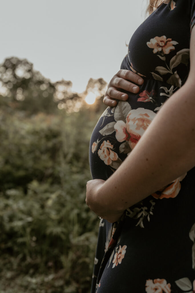 pregnant belly in the sunset